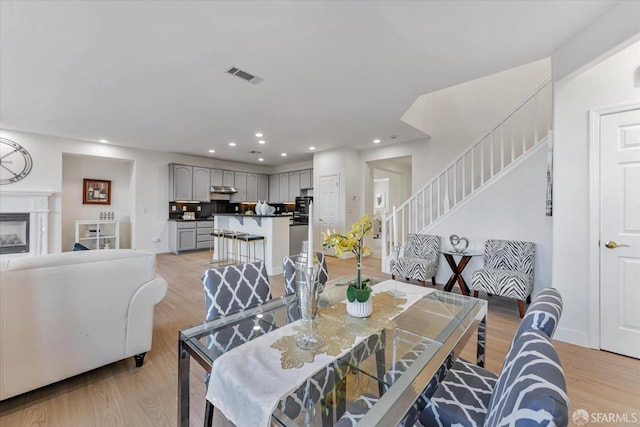 dining area with light hardwood / wood-style floors