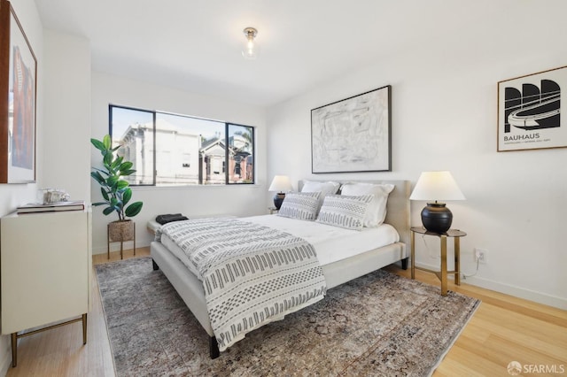 bedroom with hardwood / wood-style flooring