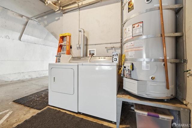 clothes washing area with independent washer and dryer and water heater