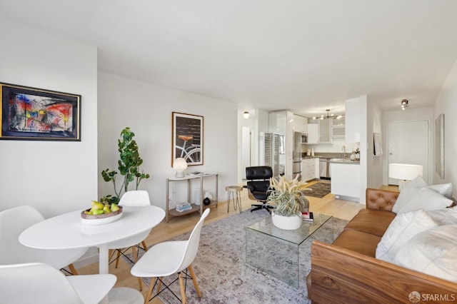 living room with light hardwood / wood-style flooring