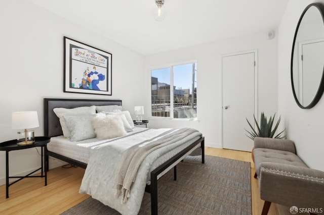 bedroom with light hardwood / wood-style floors