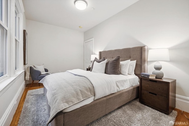 bedroom with hardwood / wood-style floors