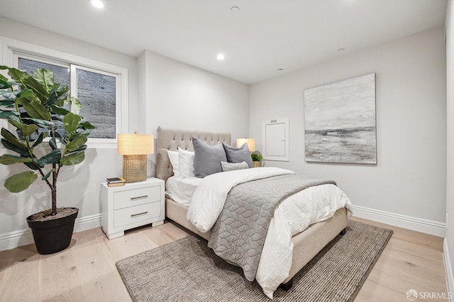 bedroom with light hardwood / wood-style flooring