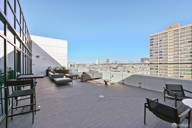 view of patio with a balcony and an outdoor hangout area