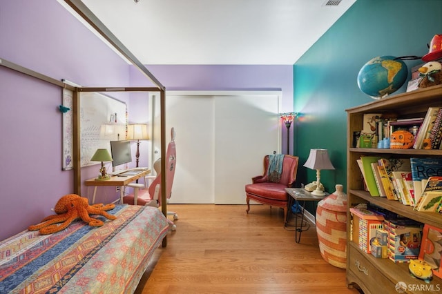 bedroom with light hardwood / wood-style flooring