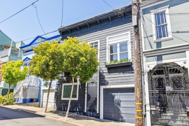 476 Hickory St, San Francisco, CA 94102 - view of front facade featuring a gate, fence private yard, and an attached garage