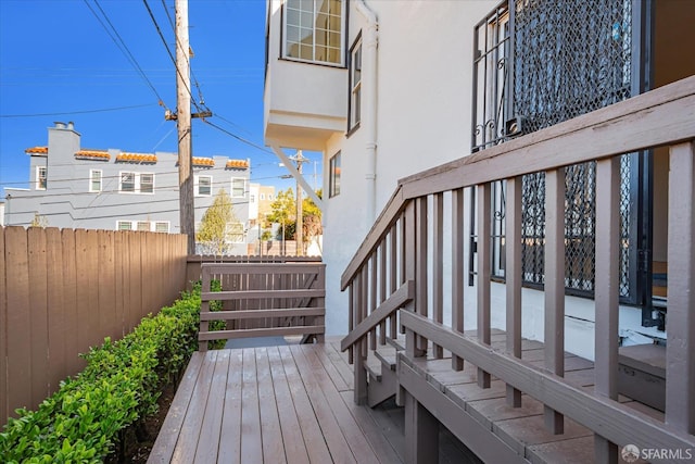 wooden deck featuring fence