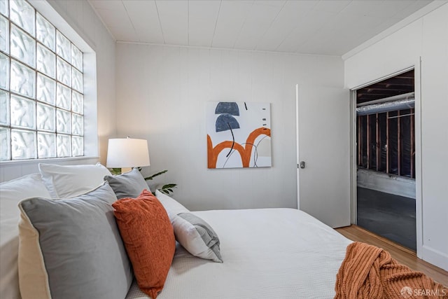 bedroom featuring wood finished floors