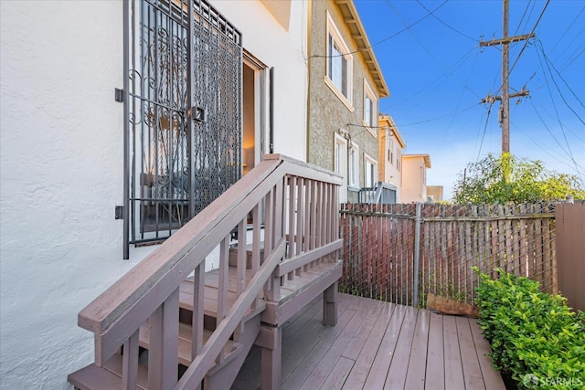 wooden deck featuring fence