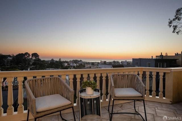 view of balcony at dusk