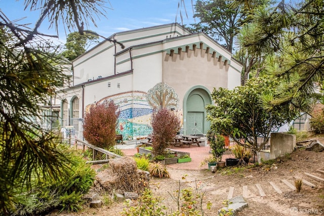 view of front of house with a patio area