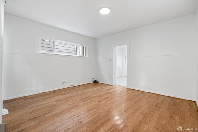 unfurnished room featuring light wood-type flooring