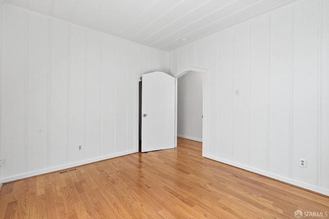 spare room featuring light hardwood / wood-style flooring