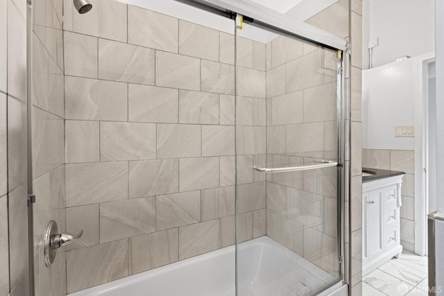 bathroom featuring enclosed tub / shower combo and vanity