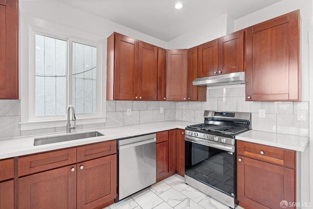 kitchen featuring sink, decorative backsplash, and stainless steel appliances