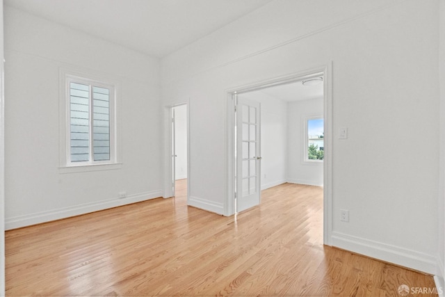 spare room featuring light hardwood / wood-style floors