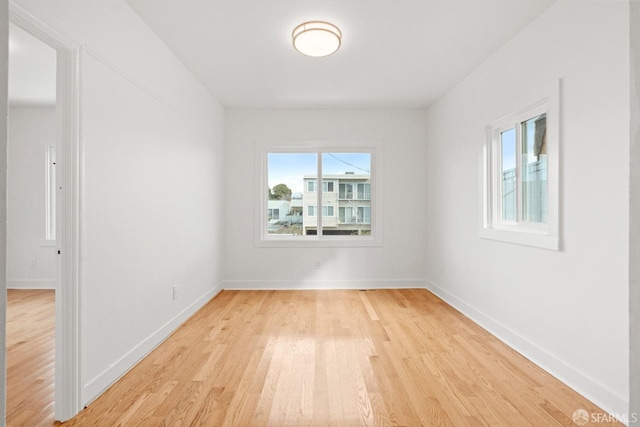 unfurnished room with light hardwood / wood-style floors