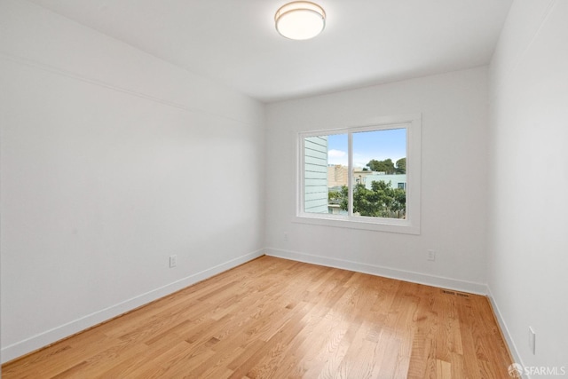 unfurnished room featuring light hardwood / wood-style flooring