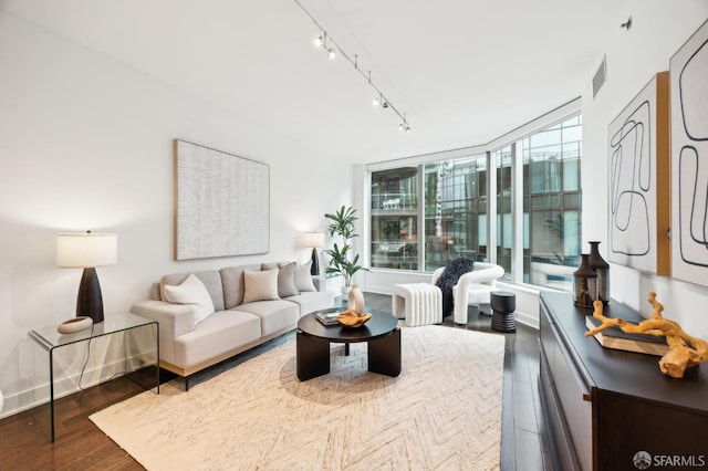 living room with track lighting and hardwood / wood-style floors