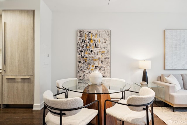 dining area featuring dark hardwood / wood-style flooring