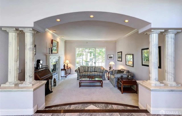 2220 Sunset Pt, Discovery Bay, CA 94505 - living room featuring ornate columns, crown molding, arched walkways, a glass covered fireplace, and baseboards