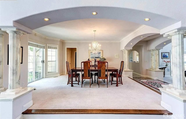 2220 Sunset Pt, Discovery Bay, CA 94505 - dining space with decorative columns, carpet, arched walkways, a chandelier, and recessed lighting