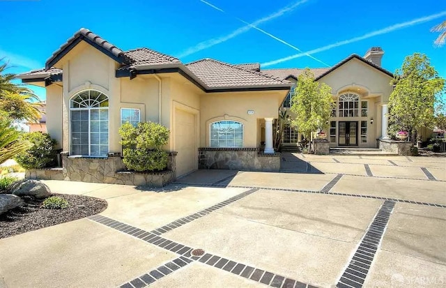 2220 Sunset Pt, Discovery Bay, CA 94505 - entrance to property featuring french doors, a tile roof, stucco siding, and a chimney