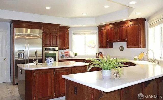 2220 Sunset Pt, Discovery Bay, CA 94505 - kitchen featuring stainless steel appliances, a kitchen island, light countertops, a peninsula, and recessed lighting