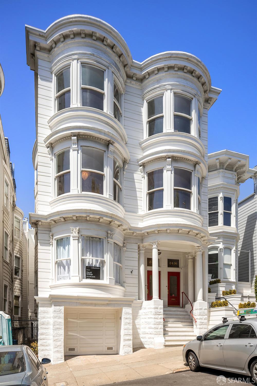 2438 Clay St, San Francisco, CA 94115 - view of front of property with a garage, concrete driveway, and stone siding