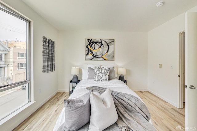 bedroom with light wood-type flooring