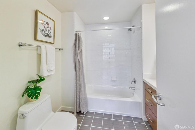 full bathroom featuring tile patterned flooring, vanity, shower / tub combo with curtain, and toilet