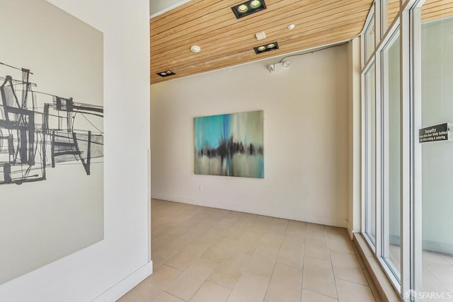 unfurnished room featuring wood ceiling