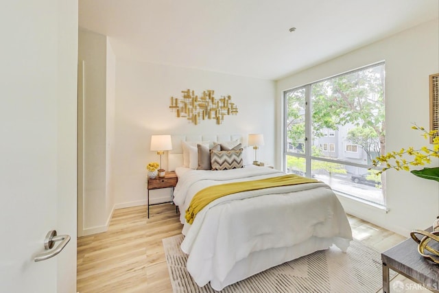 bedroom with light wood-type flooring