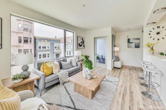 living room with light hardwood / wood-style flooring