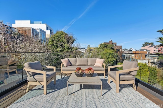 balcony with a residential view and an outdoor living space