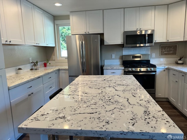 139 Hall Ln, Walnut Creek, CA 94597 - kitchen featuring stainless steel appliances, dark wood finished floors, white cabinets, light stone counters, and recessed lighting