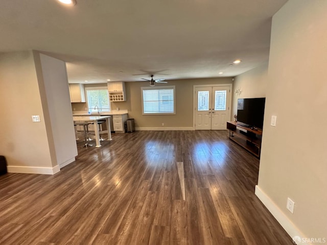 139 Hall Ln, Walnut Creek, CA 94597 - unfurnished living room featuring dark wood-style floors, baseboards, plenty of natural light, and recessed lighting