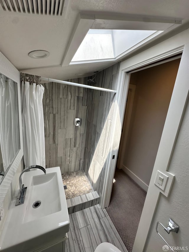 139 Hall Ln, Walnut Creek, CA 94597 - full bath featuring a stall shower, vanity, and a skylight