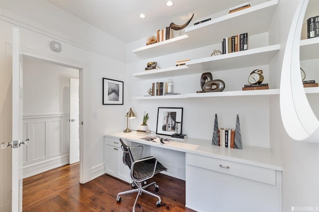 office space with dark wood-type flooring and built in desk