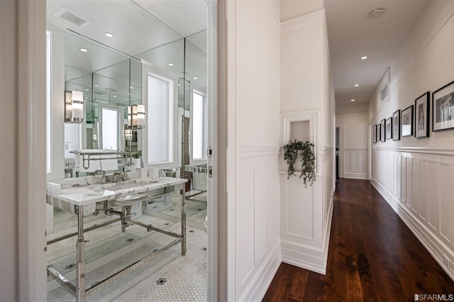 corridor featuring dark hardwood / wood-style flooring