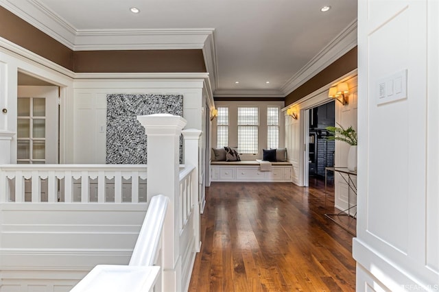 corridor featuring ornamental molding and dark hardwood / wood-style flooring