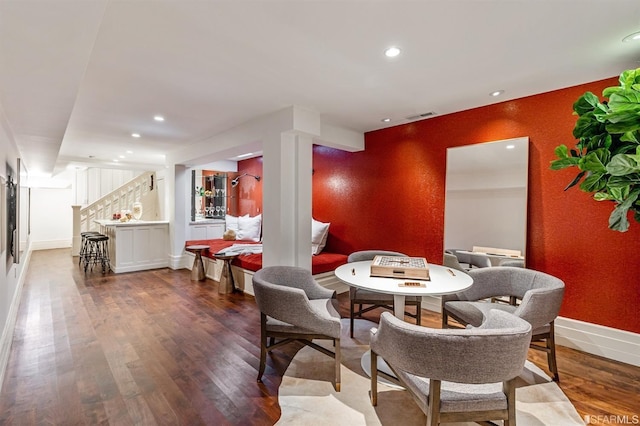 dining area featuring dark wood-type flooring