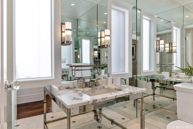 bathroom with hardwood / wood-style flooring