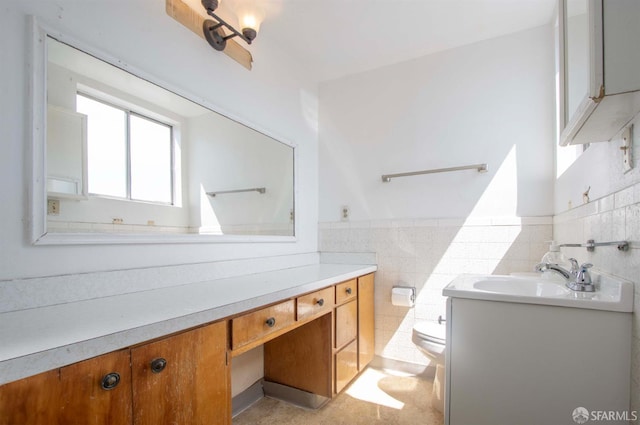 2567 Bryant St, San Francisco, CA 94110 - bathroom featuring vanity, tile walls, and a wainscoted wall