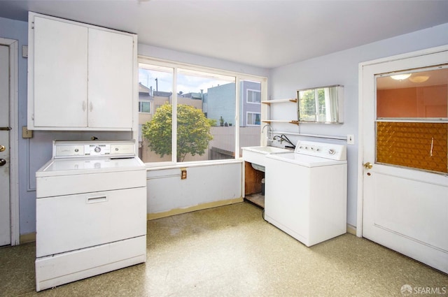 2567 Bryant St, San Francisco, CA 94110 - laundry area featuring cabinet space, healthy amount of natural light, and independent washer and dryer