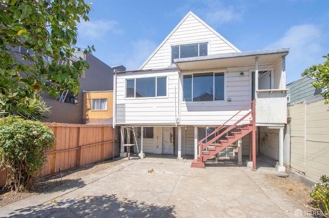 2567 Bryant St, San Francisco, CA 94110 - rear view of property featuring a patio area, a fenced backyard, and stairway