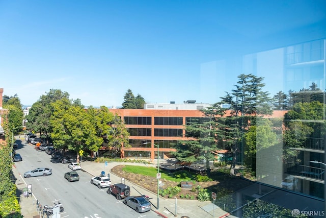 view of building exterior with uncovered parking