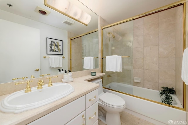 bathroom with enclosed tub / shower combo, tile patterned flooring, toilet, vanity, and visible vents