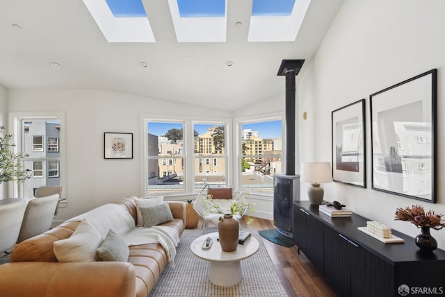 living area with dark wood-style floors, a skylight, and lofted ceiling
