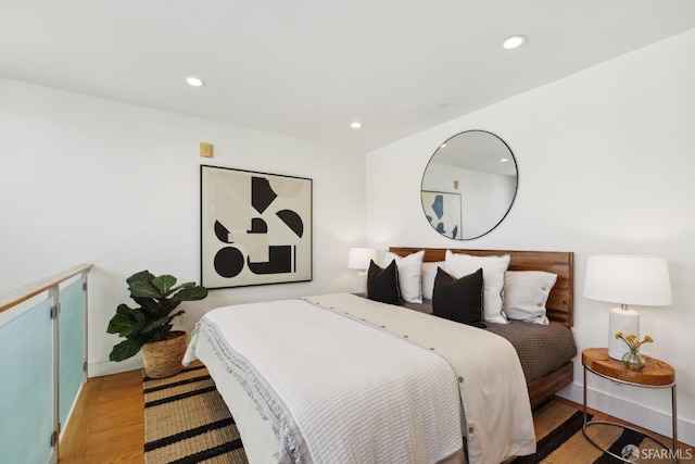 bedroom with light wood-type flooring and recessed lighting